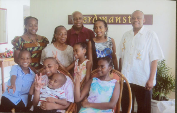 Family portrait: From left (back row): Daughter Dr Vivienne Mitchell-Amata, wife Stella, Dr Gladstone Mitchell, daughter Sonia an attorney in Jamaica and son-in-law Dr Andrew Amata. And in the front row are his grandchildren: Clemson, Raphael, Harlen, Debra and Ariande. 