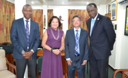 First Lady, Mrs. Sandra Granger is flanked by, from L-R : Dion Inniss, Caribbean Airlines' Guyana and Suriname Sales Representative; Tyrone Tang, Chief Executive Officer and Carl Stuart, South America Manager. (Ministry of the Presidency photo) 