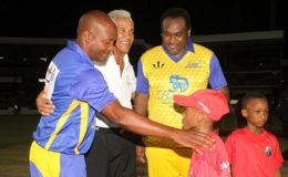 Sir Garry Sobers (middle) poses with captains of the respective teams, Brian Lara (left) and Carl Hooper prior to the start of the game. 