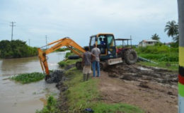 Excavator clearing drainage canal in MMA district, Region Five canal (GINA photo)