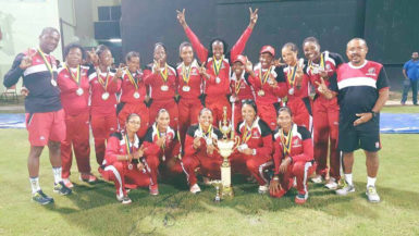 The victorious Trinidad and Tobago women’s T20 side celebrate their T20 triumph. 