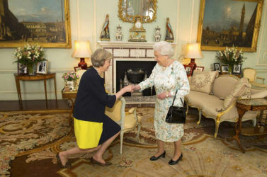 Britain’s Queen Elizabeth welcomes Theresa May at the start of an audience in Buckingham Palace, where she invited her to become Prime Minister, in London July 13, 2016. REUTERS/Dominic Lipinski/Pool