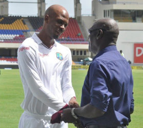 Sir Vivian Richards (right) presents Roston Chase with his West Indies cap on his debut two weeks in the first Test in Antigua. (Photo courtesy WICB Media)  