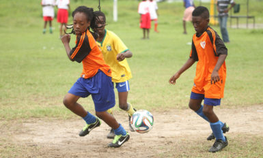 Members of the Tucville unit  on the attack during their matchup against Grove Hi-Tech-A in the Banks DIH Limited sponsored Alex Bunbury Sports and Academics Academy u-13 Championship at the Parade Ground