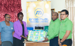 As part of the Ministry of Education’s Care and Support initiative through the School Health Programme, which is part of its efforts to reintegrate young mothers into the school system, Ansa McAl yesterday donated approximately $150,000 in baby supplies to the ministry.  In photo: Deputy Chief Education Officer Donna Chapman receives the supplies from Ansa McAl Marketing Representative Joel Lee while staff of the ministry and Ansa McAl look on.  