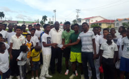 The recently selected West Indies U16 trio receiving their tokens from club mate Orande Chase in the presence of VP Ian John, Coach Garvin Nedd and other club mates