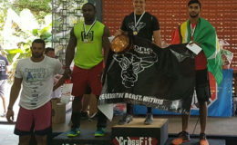 Dillon Mahadeo (right) on the podium following the inaugural CrossFit 12-12-12 Throw Down which took place at the St. Anthony's grounds in West Moorings, Trinidad on Saturday.