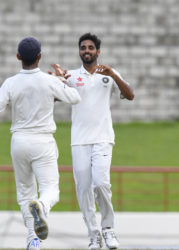 Bhuvaneshwar Kumar celebrates Marlon Samuels bowled during Day 4 of the 3rd Test between West Indies and India at Daren Sammy Cricket Ground Gros Islet, St. Lucia. Photo by WICB Media/Randy Brooks of Brooks Latouche Photography