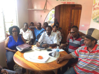 Eon Andrews (second, left in front row) with other members of the Guyana Market Vendors Union. 