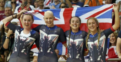 Kate Archibald, Joanna Rowsell, Elinor Barker and Laura Trott of Britain celebrate winning gold and setting a new world record. (REUTERS/Matthew Childs)