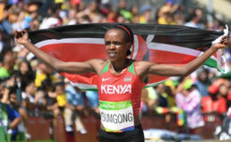 Kenya’s Sumgong evades protester to win Olympic marathon