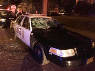 A police car with broken windows is seen in a photograph released by the Milwaukee Police Department after disturbances following the police shooting of a man in Milwaukee, Wisconsin, U.S. August 13, 2016. Milwaukee Police/Handout via REUTERS