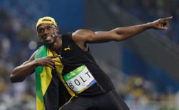 Jamaican Usain Bolt celebrates after winning the 100 metres at the Rio Olympics.