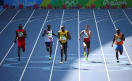 CRUISE CONTROL! Jamaica’s Usain Bolt cruises into the 200m semi-finals yesterday.
