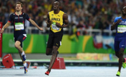 Usain Bolt of Jamaica wins gold. (REUTERS/Dylan Martinez)
