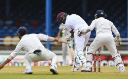 Left-hander Darren Bravo goes is bowled by off-spinner Ravi Ashwin on the opening day of the fourth Test against India. (Photo courtesy WICB Media)
