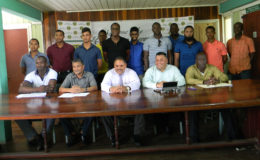Executives of the GCB (front row, seated) flanked by some of the Guyana Jaguars senior franchise players following the Jaguars 3-Day franchise launch.