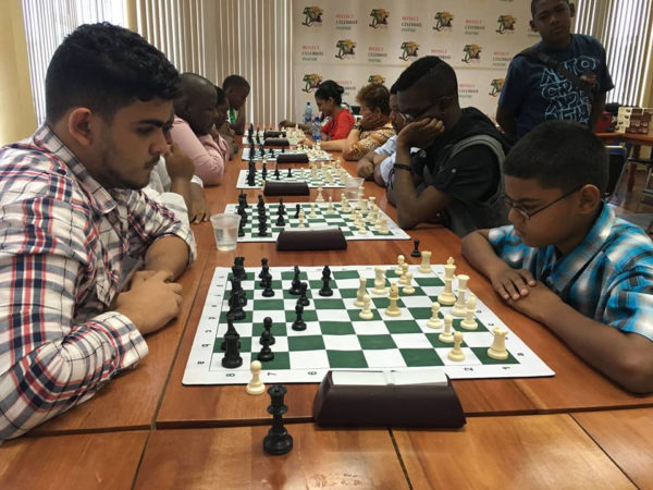 Roberto Neto, 19, (left) is a member of the 2016 Guyana Olympiad chess team. A newcomer to the game, he enjoyed some robust successes by defeating the senior and junior national champions on occasion. Although he only began playing the game in 2010, Neto has been competing regularly in tournaments and has become a prominent fixture in competitions. In this photograph, he faces St Stanislaus’ student Gansham Alijohn in a recent tournament.