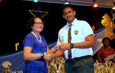 Khishan Singh receiving a prize from First Lady Sandra Granger at the Bishops’ High School Prize Giving ceremony earlier this year.