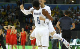 Diana Taurasi of the U.S. hugs team mate Angel McCoughtry after winning the gold in basketball. REUTERS/Jim Young 