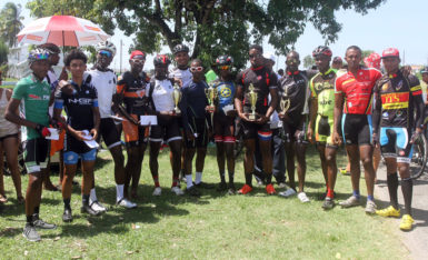 The top performers of the inaugural Flying Star Cycle Club multi-race memorial programme pose with their spoils yesterday. (Orlando Charles photo)