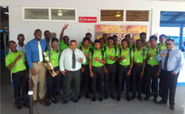 THREE-TIME CHAMPS! The victorious Guyana U19 team along with GCB Executives and Director of Sport Chris Jones.