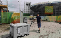 BACK TO THE DAILY GRIND! A worker pulls a storage bin in the Olympic Park a day after the closing ceremony of the Rio Olympic Games in Brazil. (Reuters/Bruno Kelly)
