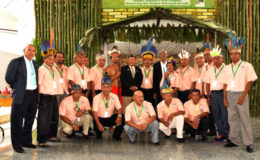 President David Granger (standing seventh, right) with members of the National Toshaos Council (NTC), Minister of Indigenous Peoples’ Affairs Sydney Allicock (standing eighth, left) and Minister of Public Health Dr George Norton (left) at yesterday’s opening ceremony of the 10th annual NTC Conference at the Arthur Chung Convention Centre.  