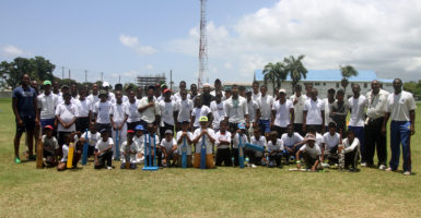 Youths of the Malteenoes Summer Camp share a picture with guest speaker Assad Fudadin (center) while coach Mark Harper, Reon King and Steven Jacobs were there also. 