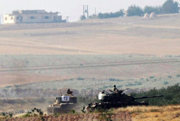 Turkish army tanks are pictured in Karkamis on the Turkish-Syrian border in the southeastern Gaziantep province, Turkey. REUTERS/Stringer  