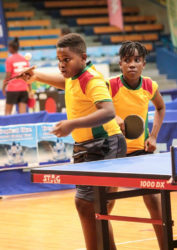 Kaysan Ninvalle and Abigail Martin in action during their mixed doubles matchup at the 2016 Caribbean Pre-Cadet Table Tennis Championships at the National Arena in Kingston, Jamaica.     