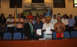 From left front row: Minister of Indigenous Peoples Affairs Sydney Allicock, Executive Director of CI-Guyana Dr David Singh, Chairman of the NTC Toshao Joel Fredericks and Vice-Chairman of the NTC Toshao Lennox Shuman flanked by other executive members of the NTC following the signing of yesterday’s MoU between CI-Guyana and the NTC.
