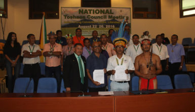 From left front row: Minister of Indigenous Peoples Affairs Sydney Allicock, Executive Director of CI-Guyana Dr David Singh, Chairman of the NTC Toshao Joel Fredericks and Vice-Chairman of the NTC Toshao Lennox Shuman flanked by other executive members of the NTC following the signing of yesterday’s MoU between CI-Guyana and the NTC.      