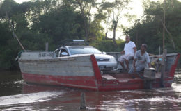 What if you miss the ferry? A speedboat will do. This car managed the Essequibo crossing between Supenaam and Parika in a speedboat. (Photo by Joanna Dhanraj) 