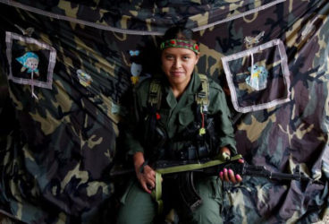 Leidi, a member of the 51st Front of the Revolutionary Armed Forces of Colombia (FARC), poses for a picture at a camp in Cordillera Oriental, Colombia, August 16, 2016 (Reuters/John Vizcaino)
