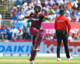 Opener Evin Lewis celebrates his maiden Twenty20 International hundred yesterday. (Photo courtesy WICB Media)  