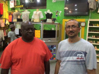 Owner of Colours, Melton Branford (left) and Suresh Narine owner of Narine’s Liquor Store.