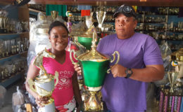 In picture, Tiana Lovell   of the Trophy Stall hands over the champion jockey trophy and the President’s Cup to Wayne Campayne.