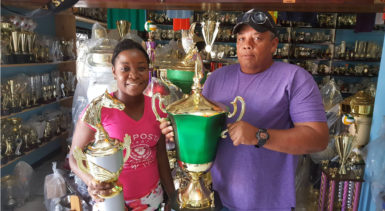 In picture, Tiana Lovell   of the Trophy Stall hands over the champion jockey trophy and the President’s Cup to Wayne Campayne.