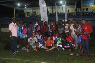 The Guyana Police Force Athletic Club posing with their hardware following the Boyce/Jefford Classic last night at the Mackenzie Sports Club (MSC) ground. They are flanked by Digicel’s reps, Ulex Smith and Luoanna Abrams and the top brass of the fixture, Edison Jefford and Colin Boyce. (Orlando Charles photo)
