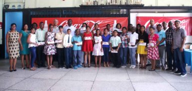 The bursary awards winners with company officials (Banks DIH photo) 