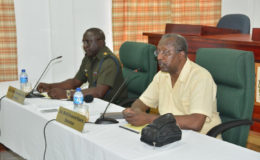 From right are Chairman of the CoI, Retired Colonel Desmond Roberts and CoI Secretary, Col. Denzil Carmichael (Ministry of the Presidency photo)
