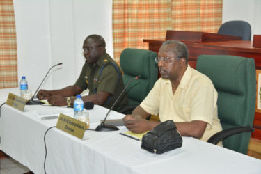 From right are Chairman of the CoI, Retired Colonel Desmond Roberts and CoI Secretary, Col. Denzil Carmichael (Ministry of the Presidency photo)