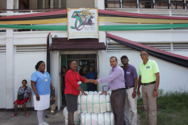 In photo: Silochanie Singh receives the donation from CEO of FFP Kent Vincent while Nurse Shaundelle Inniss-Munroe, Wayne Hamilton and Compton Giddings look on. 