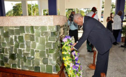 President David Granger lays a wreath at the Mausoleum in the Botanical Gardens. (Ministry of the Presidency photo)