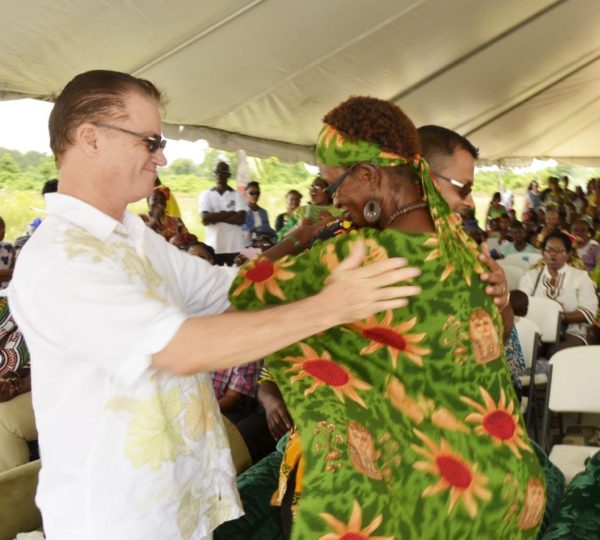 Region Six Chairman Vickchand Ramphal and Carol Joseph embracing. At left is PPP/C MP (Ministry of the Presidency photo) 
