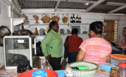 Minister in the Ministry of Natural Resources (left), Simona Broomes meeting with the women’s group of Moruca, Region One in their craft shop (GINA photo)