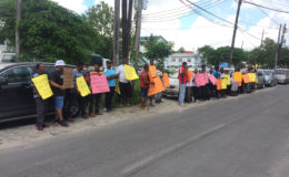 The picketers in front of the Ministry of Business on South Road yesterday.
