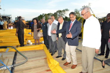 President David Granger, together with Gaico's CEO, Komal Singh and other dignitaries examining the equipment that would be used to skim the oil during a spill 