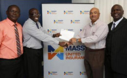 In picture, Branch Manager Lindel Harlequin gives the sponsorship cheque to Lusignan Golf Club President Oncar Ramroop. Looking on are (at left) Massy United Claims Officer Vibert Austin, and (at right) Golf Club PRO, Guy Griffith.